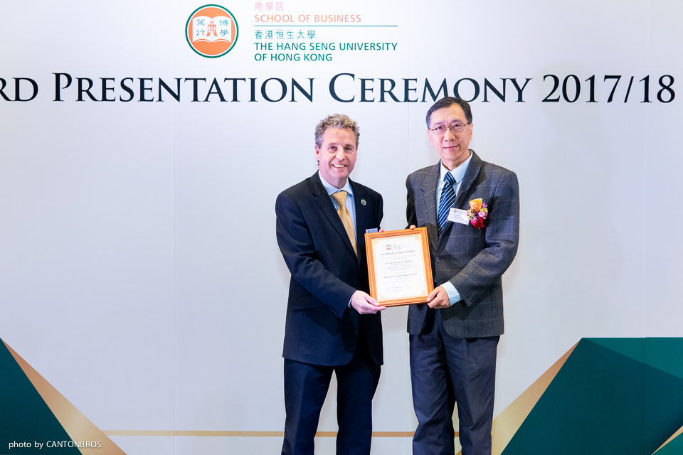 Prof Barnes (left) presented the award to Dr Haksin Chan