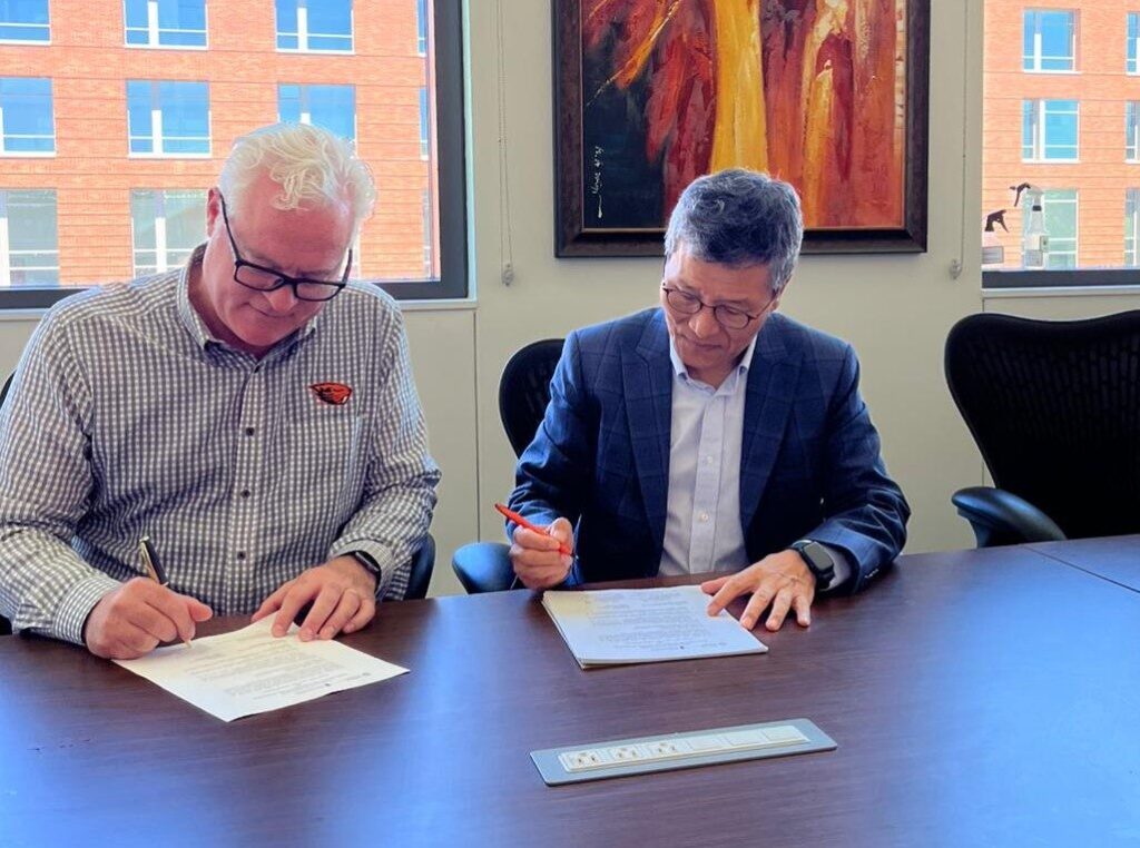 Dean Park (right) sights MoU with partner universities